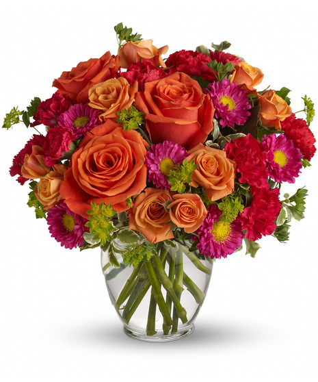 This charming mix of fresh blooms in ripe, fruity shades of raspberry, peach and cherry is a tempting.