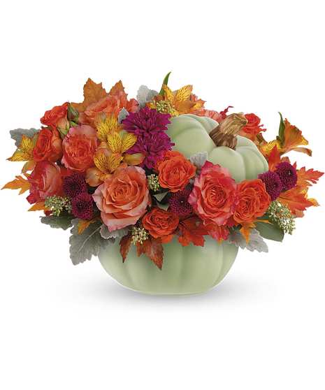 Orange roses, orange alstroemeria, orange carnations, purple button chrysanthemums, purple cushion chrysanthemums, dusty miller and seeded eucalyptus in a Sage Harvest Pumpkin